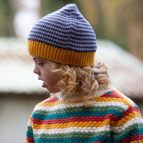 Boy wearing Little Green Radicals Organic Knitted hat- dreamy blue striped