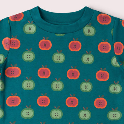 Teal shirt with apple pattern on a white background