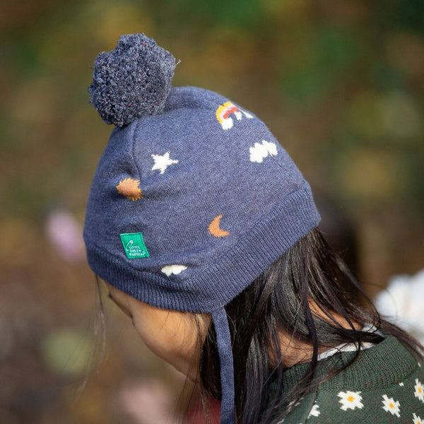 Girl wearing Little Green Radicals Organic Knitted hat- sun and stars