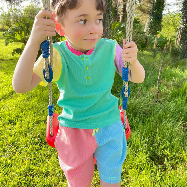 Boy wearing Slugs & Snails organic Waffle top & shorts set- '90s neon