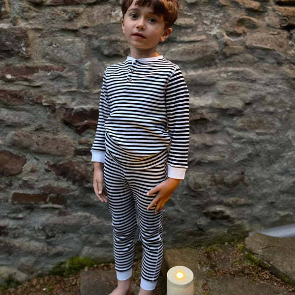 Boy wearing Slugs & Snails Organic Waffle top & pants set- black & white stripe