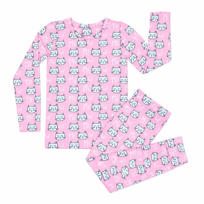 Pink pajama set with cat pattern on a white background