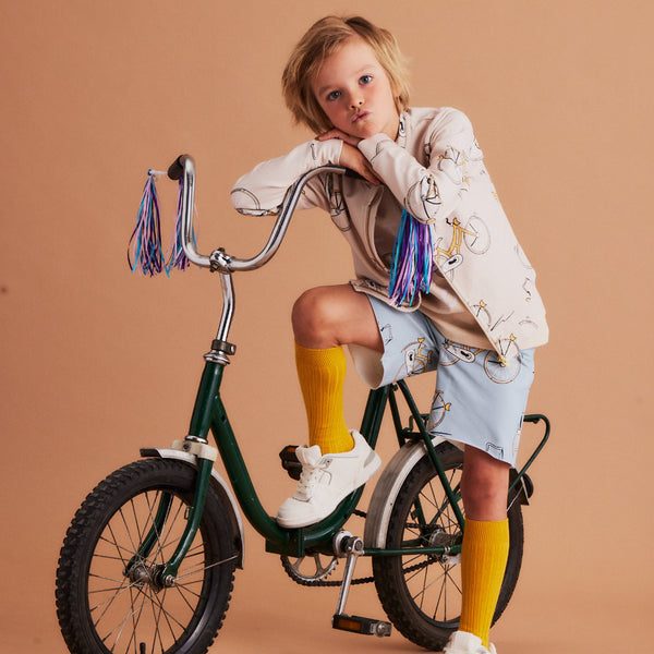 Boy wearing Dear Sophie organic Shorts- bike blue