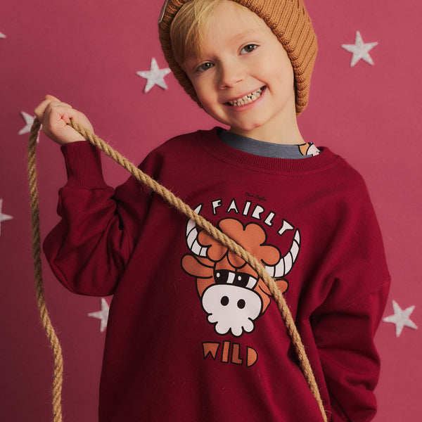 Boy wearing Dear Sophie organic Sweatshirt- bull dark red