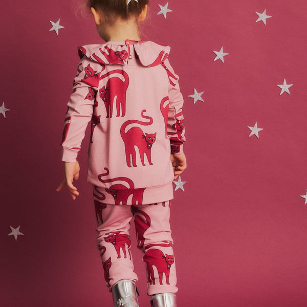 Girl wearing Dear Sophie organic leggings- cat pink