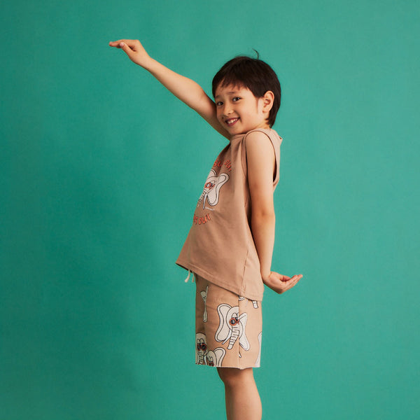 Boy wearing Dear Sophie organic Shorts- elephant beige