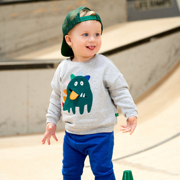Boy wearing Fred's World organic Sweatshirt- monster appliqué