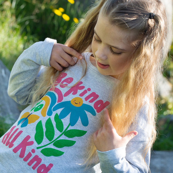 Girl wearing Frugi organic Be kind to all kind top