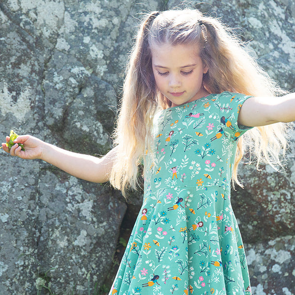 Girl wearing Frugi organic Skater dress- forest fairies