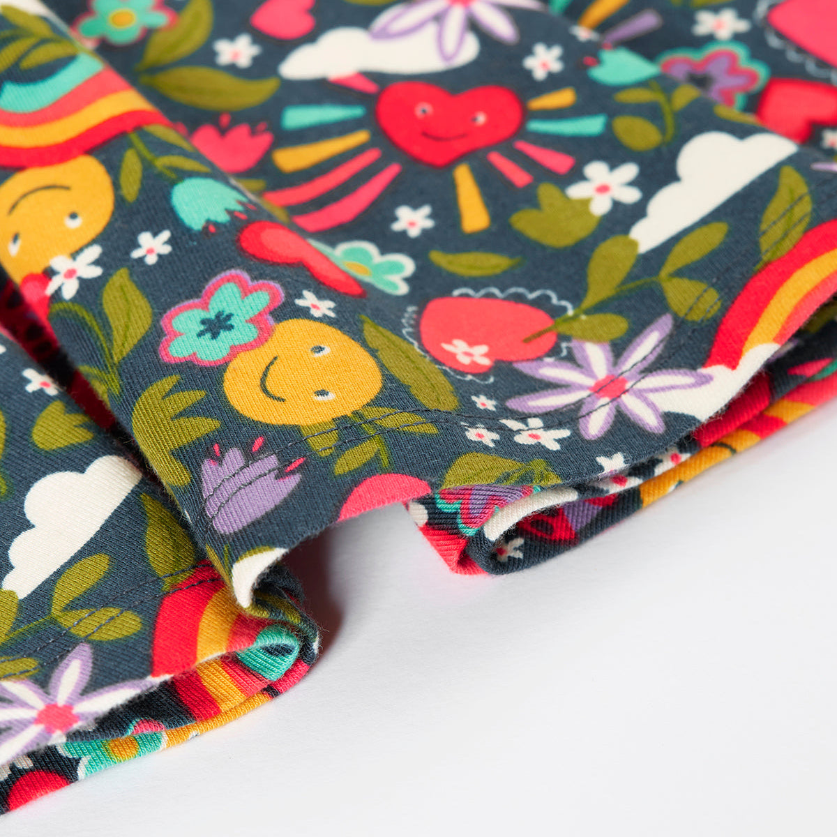 Colorful fabric with heart and flower pattern on a white background