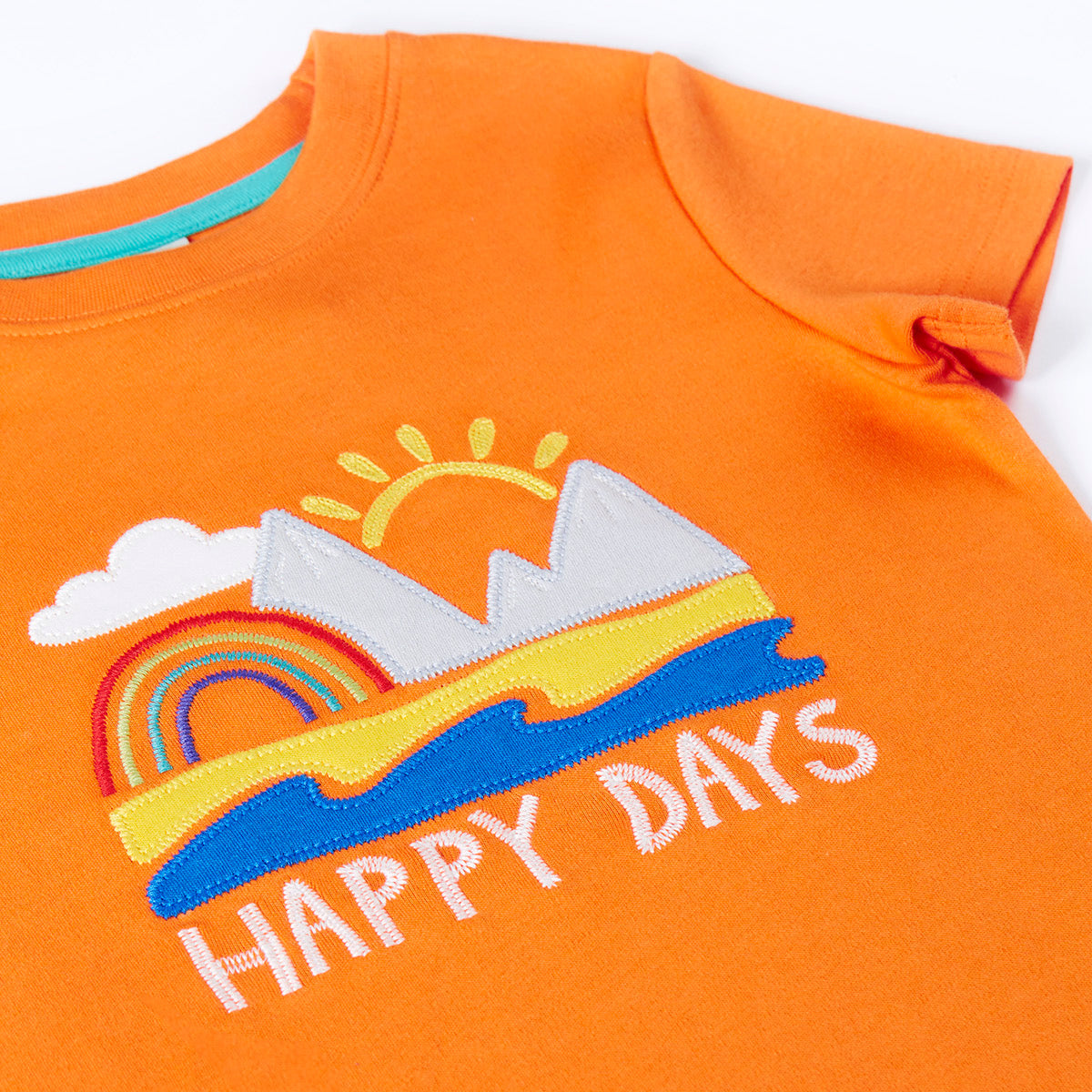 Orange t-shirt with a colorful graphic and 'Happy Days' text on a white background