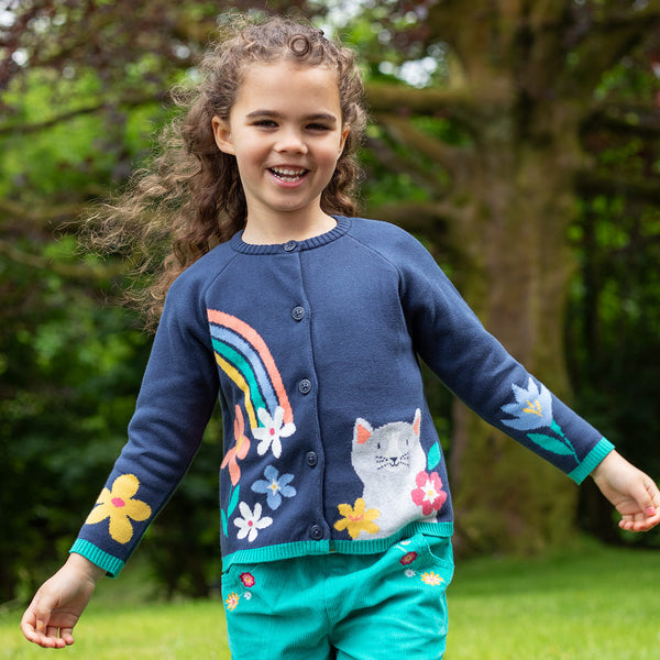 Girl wearing Frugi organic Knit cardigan- navy blue/cat