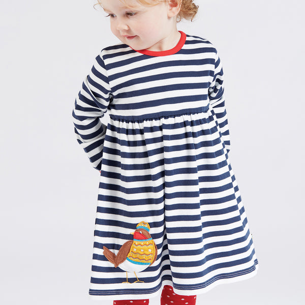 Baby wearing Frugi organic Robin appliqué striped dress