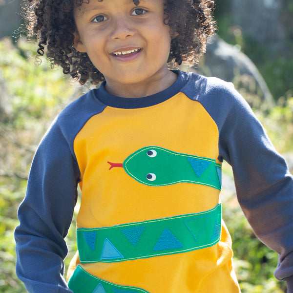 Boy wearing Frugi organic Snake appliqué top