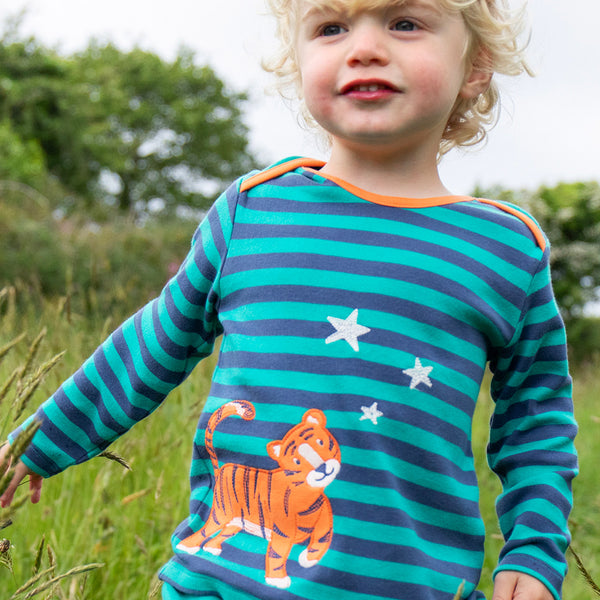 Boy wearing Frugi organic Long sleeved top- tiger appliqué