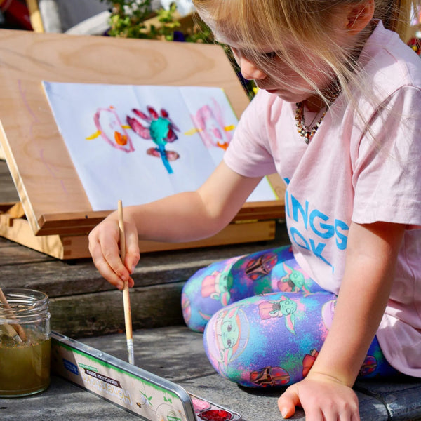 Child using Honeysticks natural watercolor paints