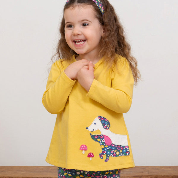 Girl wearing Kite organic Dachshund tunic