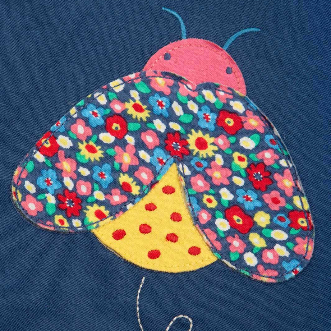 Kite organic T-shirt- ladybug appliqué, closeup