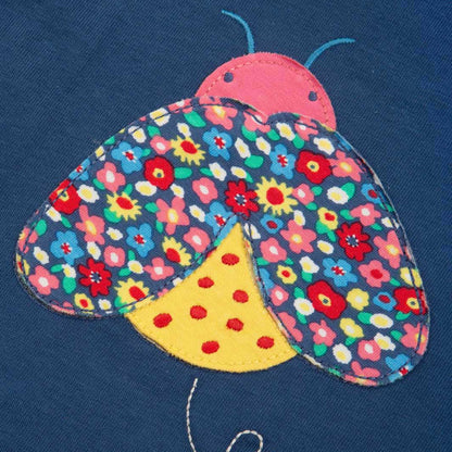 Kite organic T-shirt- ladybug appliqué, closeup