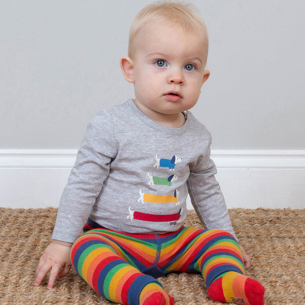 Baby wearing Kite organic Rainbow turtle knit leggings
