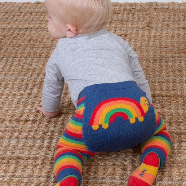 Baby wearing Kite organic Rainbow turtle knit leggings