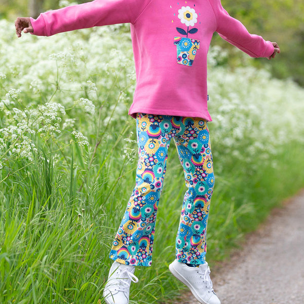 Girl wearing Kite organic Patchwork planet leggings