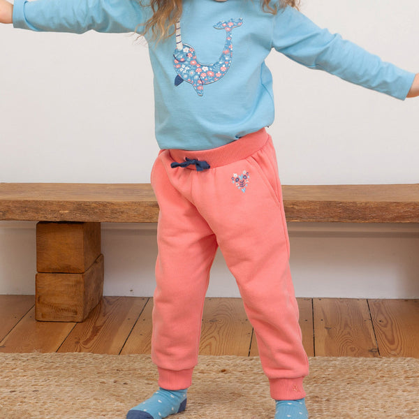 Girl wearing Kite organic Joggers- pink heart