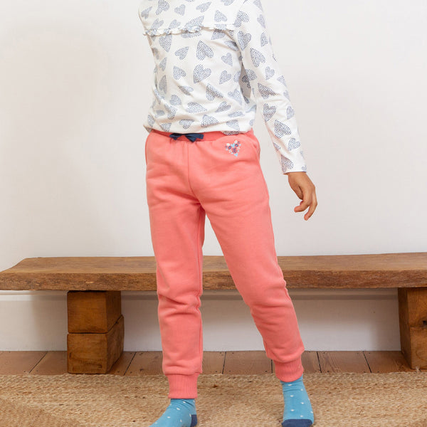 Girl wearing Kite organic Joggers- pink heart