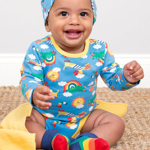 Baby wearing Kite organic Planet pals bodysuit