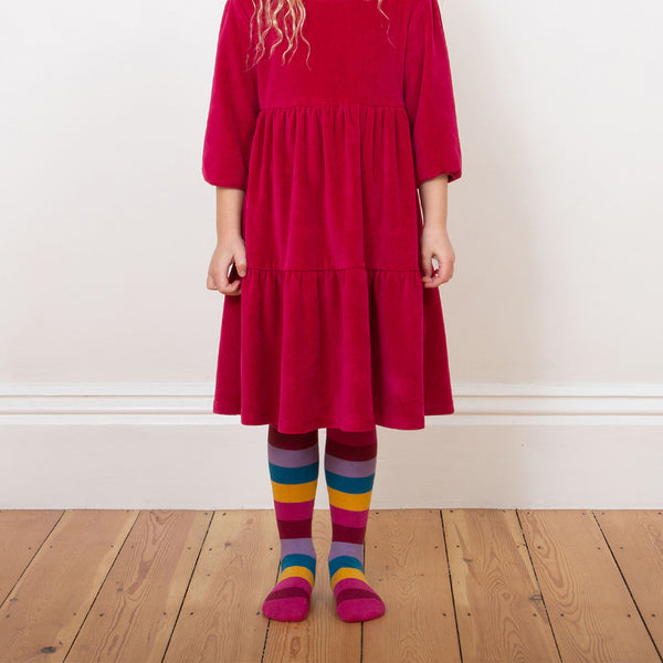 Girl wearing Kite organic Rainbow tights