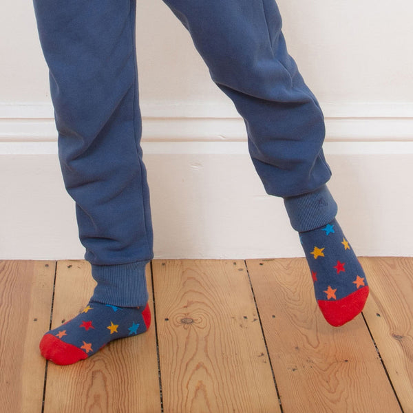 Boy wearing Kite organic Star boost socks