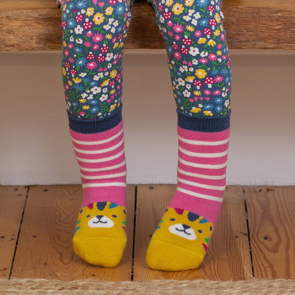 Girl wearing Kite organic Tiger grippy socks- blush pink