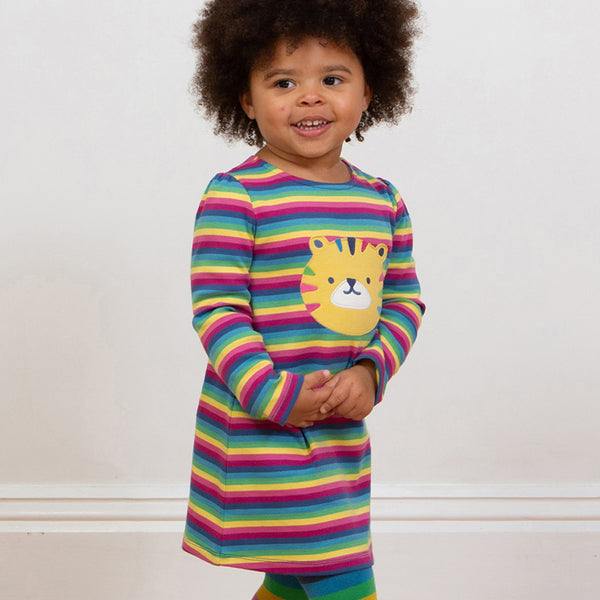 Girl wearing Kite organic Tiger appliqué dress