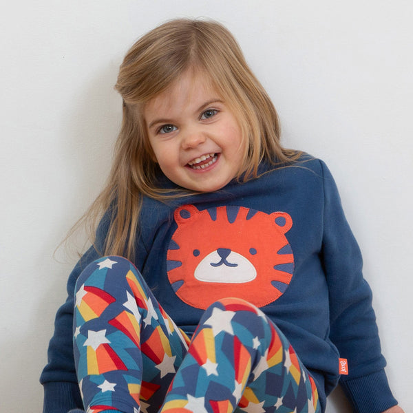 Girl wearing Kite organic Tiger appliqué sweatshirt