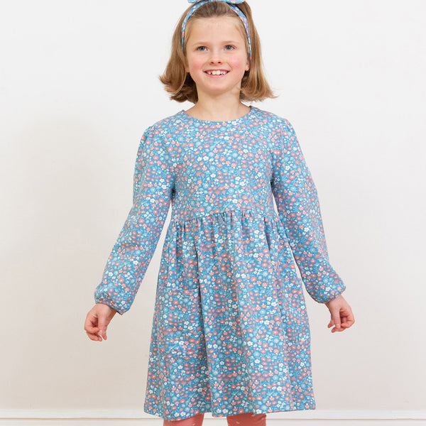 Girl wearing Kite organic Dress- winter woodland