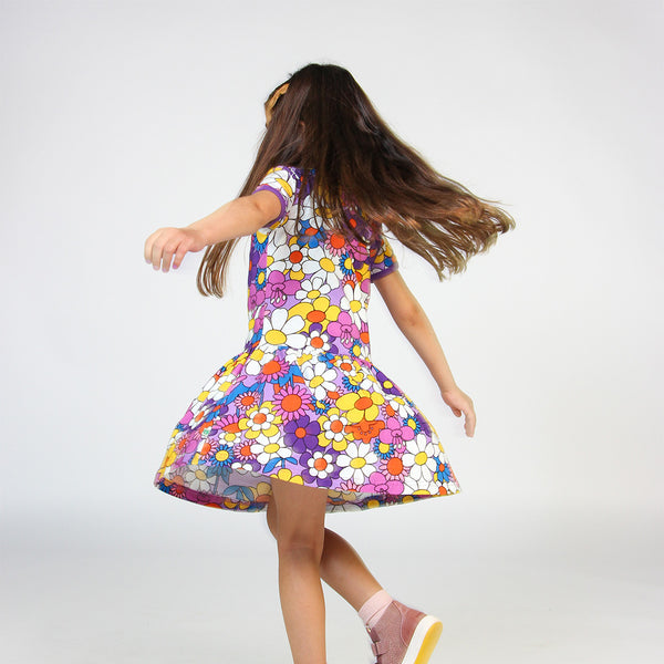 Girl wearing Samfolk organic Short sleeved dress- flowers, viola