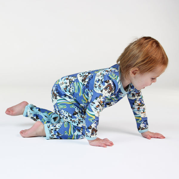 Baby wearing Smafolk organic Playsuit- winter landscape