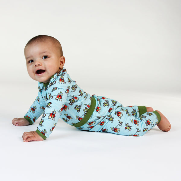 Baby wearing Smafolk organic Pants- sledding rabbits