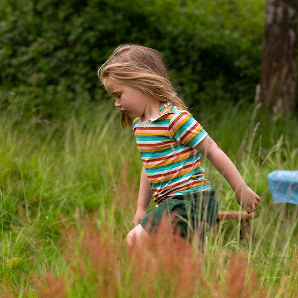 Girl wearing Little Green Radicals organic Short sleeve t-shirt- rainbow striped