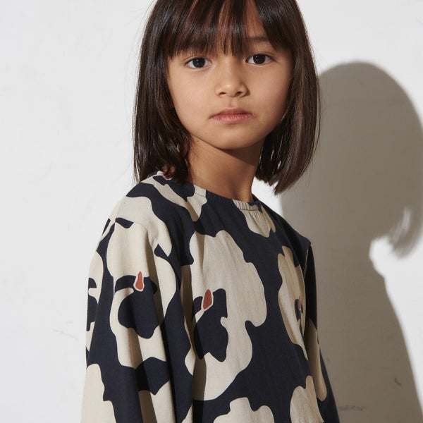 Girl wearing Mainio organic dress- autumn viola