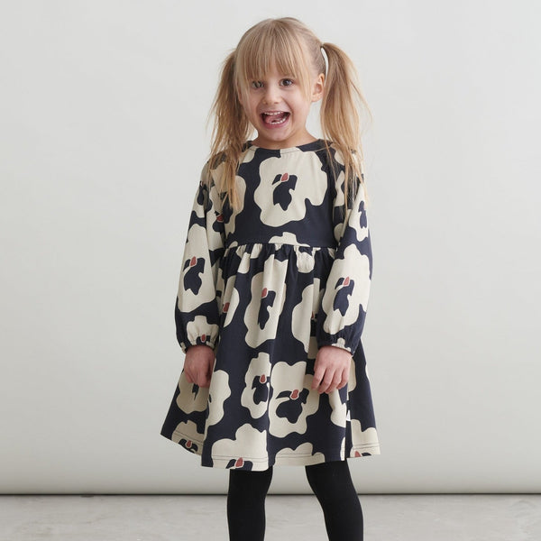 Girl wearing Mainio organic dress- autumn viola