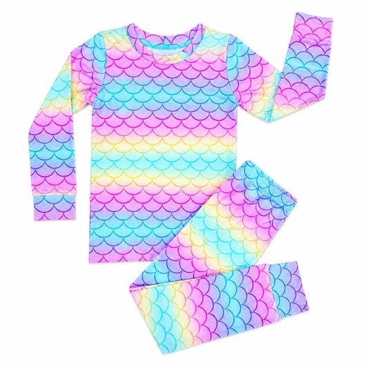 Colorful mermaid scale pattern outfit with top, leggings, and headband on a white background
