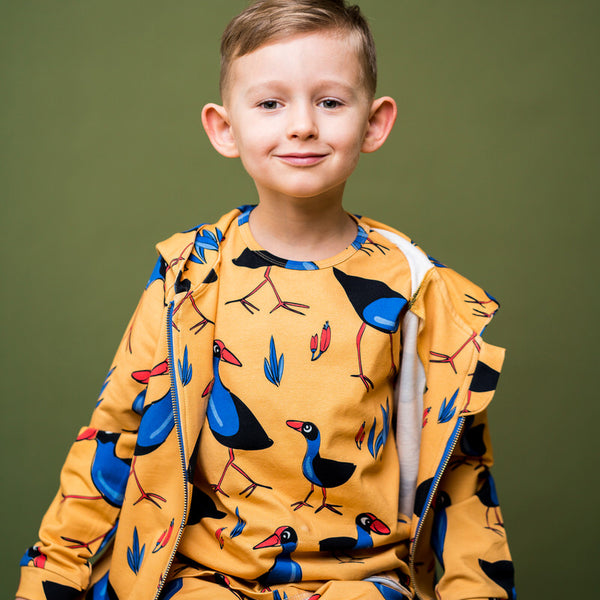 Boy wearing Mullido organic Long sleeve top- pukeko bird