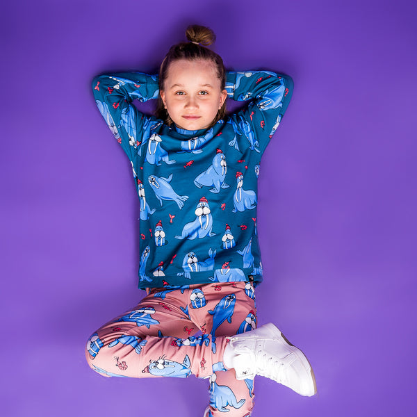 Girl wearing Mullido organic Sweatshirt- teal walrus