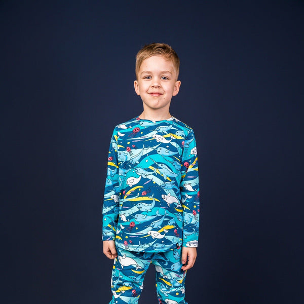 Boy wearing Mullido organic Long sleeved top- teal narwhal