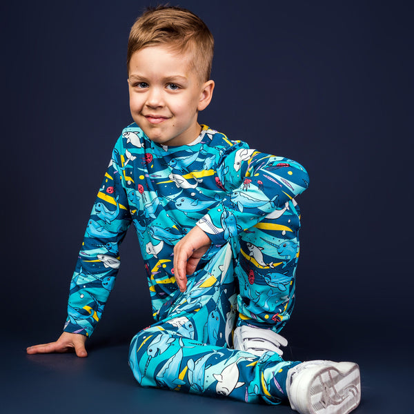 Boy wearing Mullido organic Long sleeved top- teal narwhal