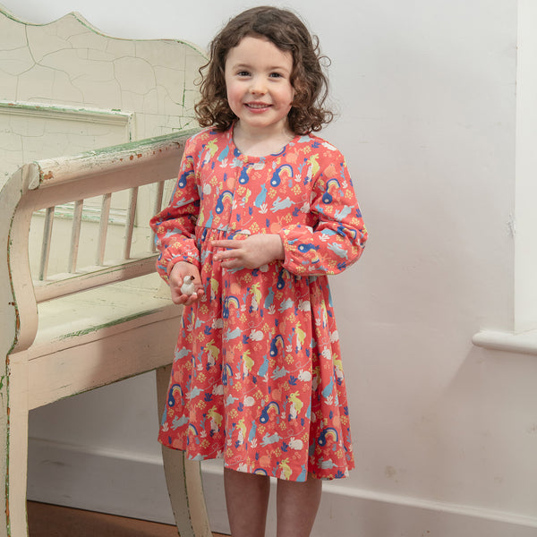Girl wearing Piccalilly organic Long sleeve dress- bunny hop