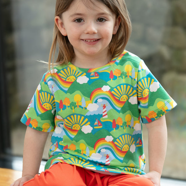 Girl wearing Piccalilly organic All over print t-shirt- island life