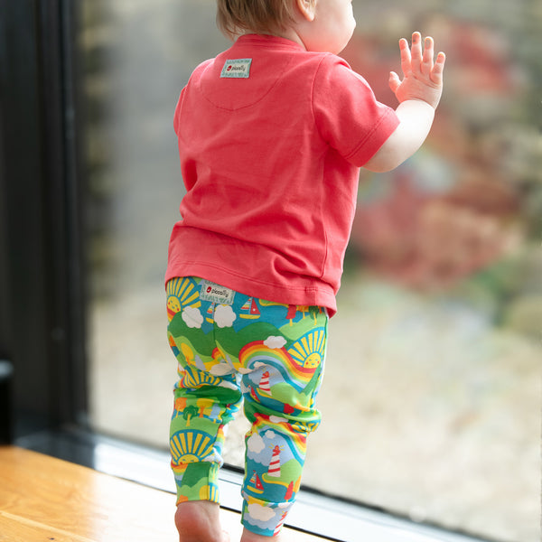 Baby wearing Piccalilly organic Top and pants set- island life