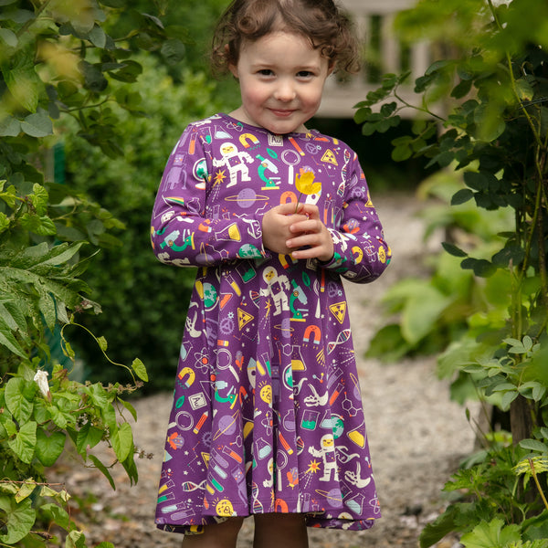 Girl wearing Piccalilly organic Skater dress- science